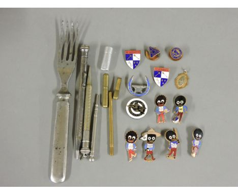Six enamel Robertson's Golly badges, two 'UP NARKOVER' badges, military fork , propelling pencils.