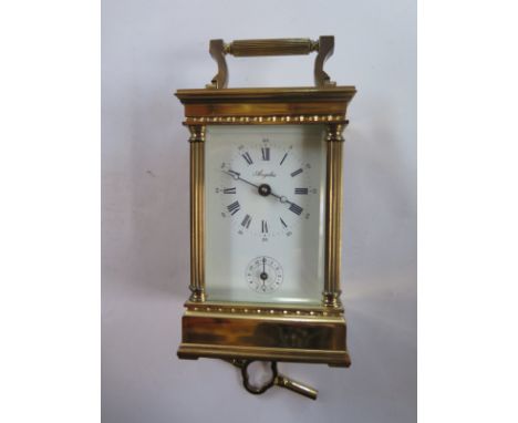 A French brass presentation carriage clock, 14cm tall with alarm, running in saleroom, with key 