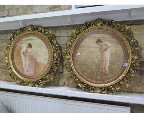 A pair of prints in ornate gilt acanthus circular frames 72cm diameter 