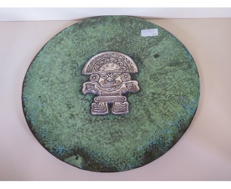 A hammered copper and white metal Inca style plaque 35cm diameter 
