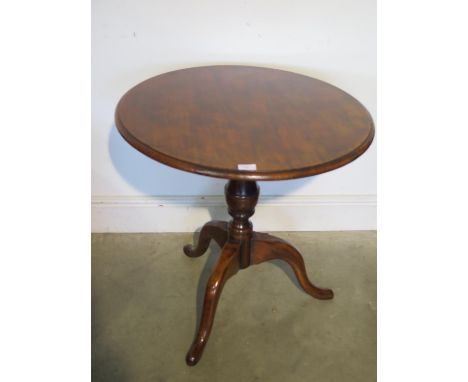 A Georgian style tripod side table 66cm tall x 68cm diameter 