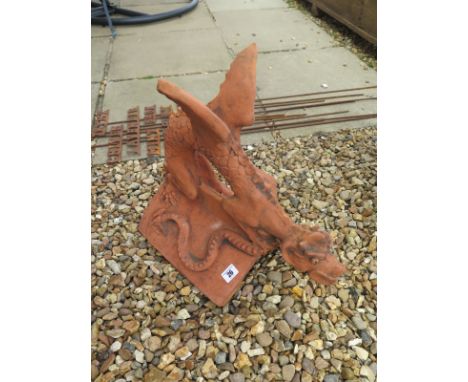 A terracotta roof ridge tile surmounted by a dragon on a 'V' ridge tile - 46cm L x 44cm H 