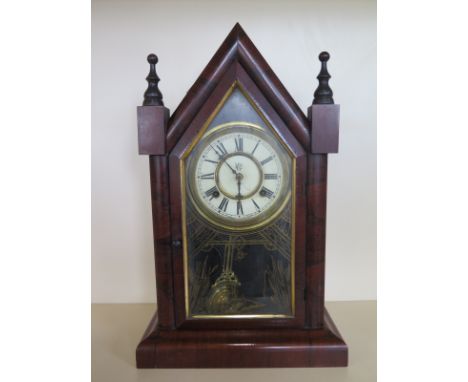 A Rosewood Waterbury Clock Co, Gothic style mantle clock - 50cm tall with pendulum and key 