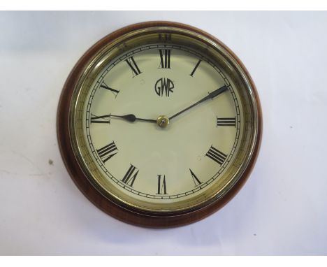 A brass wall bulkhead clock with a painted 6" dial, in clean running order 