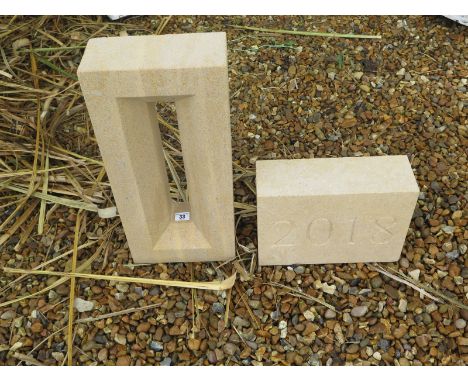 A hand carved limestone 2018 date stone and arrow slit window - 50cm tall  x 22cm 