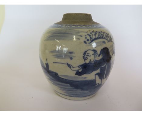 A 19th Century blue and white Chinese jar, lacking lid, sketch of a man lighting a fire-work while covering ear, 11cm tall, n