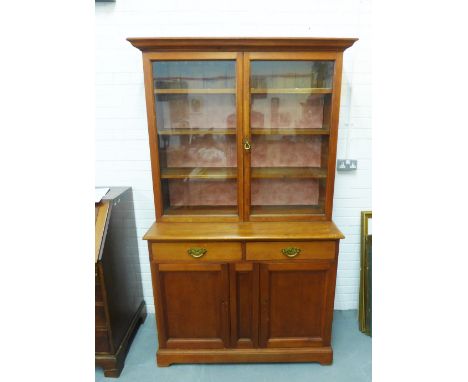 19th century mahogany bookcase cabinet, the cornice top over a pair of glazed doors with two cupboards to the base, 204 x 128