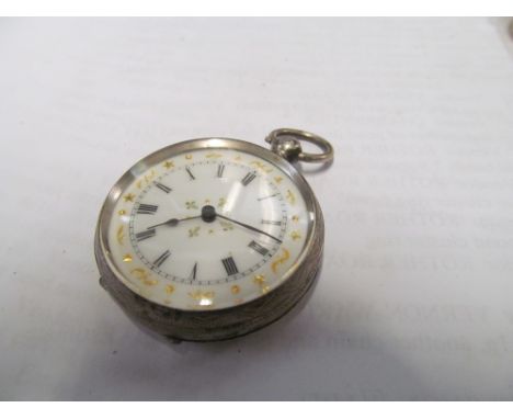 A silver pocket watch with white enamel dial