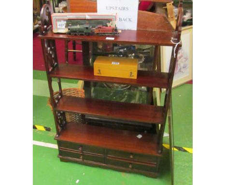 A mahogany narrow display shelf with drawer to base and a similar wall shelf
