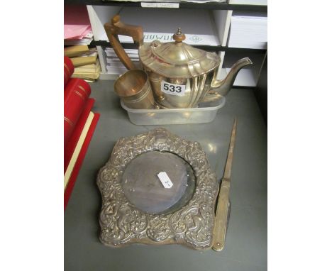 A plated teapot, silver cup, silver handled paperknife/penknife and a silver photo frame