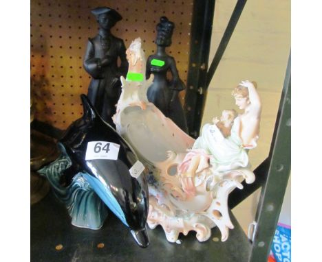 A pair of black bisque figures 18th Century man and lady, Poole Pottery dolphin and an Edwardian boat shaped vase with lady a