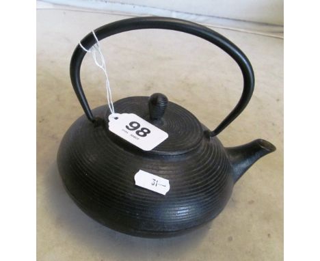 A Japanese metal teapot with infuser