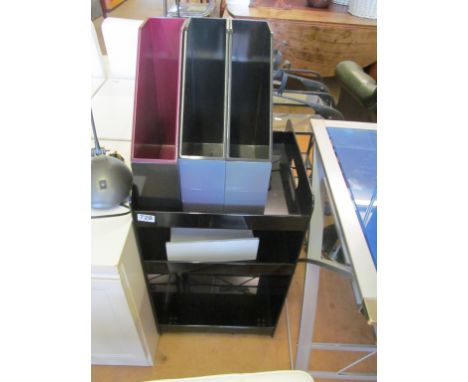 A black perspex three tier trolley/table, three filing boxes and a desk light