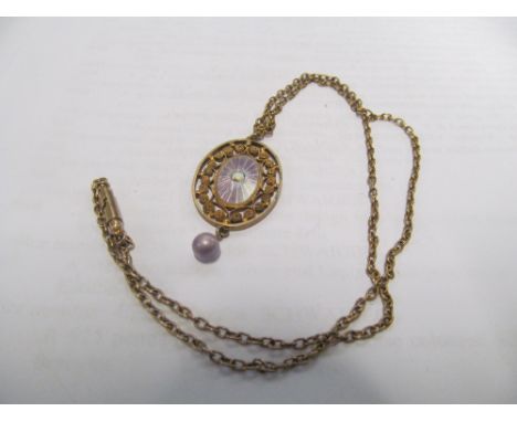 A pretty enamel and filigree oval pendant on chain