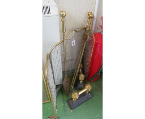 A brass three fold firescreen and pair brass firedogs and irons
