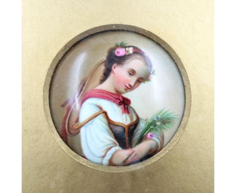 Ceramic portrait miniature of a young girl, D: 65 mm. P&amp;P Group 2 (£18+VAT for the first lot and £3+VAT for subsequent lo