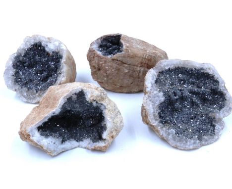 Four quartz geode specimens, largest D: 10 cm. P&amp;P Group 1 (£14+VAT for the first lot and £1+VAT for subsequent lots) 