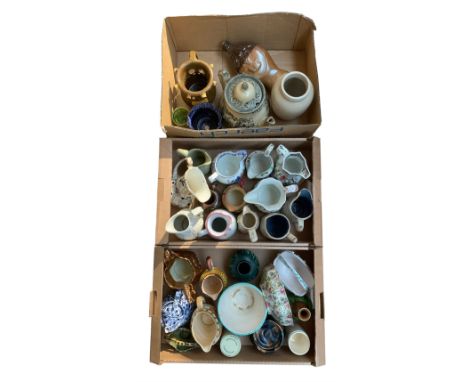 Quantity of ceramic jugs with other china in three boxes, including ironstone etc.