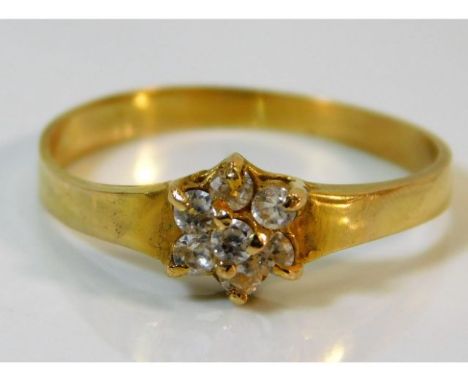 An 18ct gold ring set with seven diamonds of approx. 0.21ct 2.1g, size R, fault with one claw 