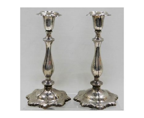 A pair of Henry Wilkinson &amp; Co. 1877 Sheffield silver candlesticks 10in tall approx. 1325g loaded. Provenance: Originally