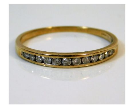 A 9ct gold half eternity ring set with 0.25ct diamonds, size T/U 1.6g
