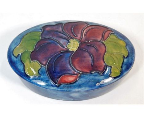 An floral oval Moorcroft pottery trinket box, Potters to Late Queen Mary label to underside 5.25in
