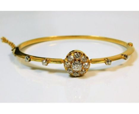 A 15ct gold (electronically tested) 19thC. bangle set with approx. 1.3ct of old cut white, lively diamonds, 9.8g