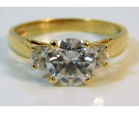 A 14ct gold trilogy ring set with paste stones, size R, 4g 