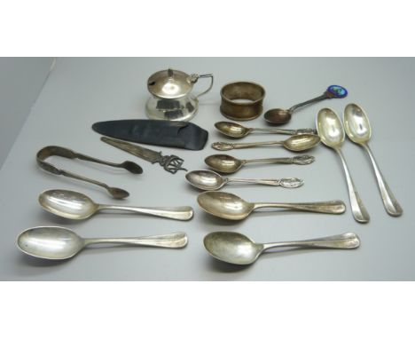 A set of six silver spoons, five other silver spoons, a silver napkin ring, a silver mustard, a pair of silver sugar bows and