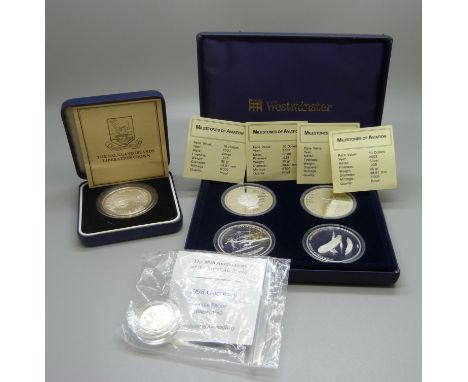 An 80th Anniversary of the Royal Air Force 1998 silver proof £1 coin, a set of four Milestones of Aviation silver proof coins