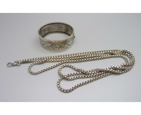 A vintage silver bangle, marked 925, and long guard chain 