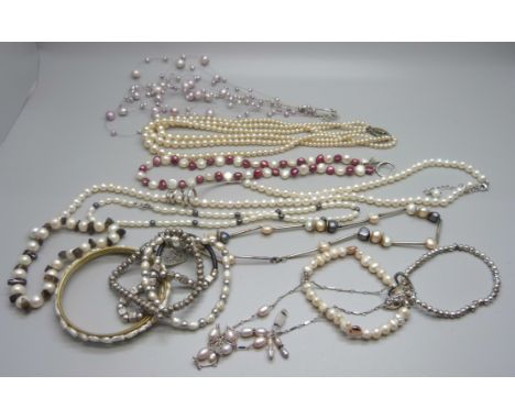 A collection of cultured pearl, seven necklaces and five bracelets, necklaces with silver clasps 