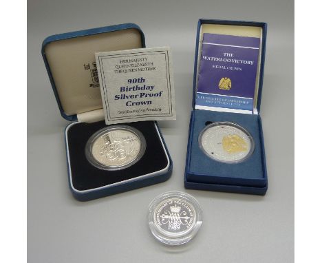 A The Royal Mint 90th Birthday silver proof crown, a Waterloo Victory Medal crown and a Tercentenary of the Claim of Right si