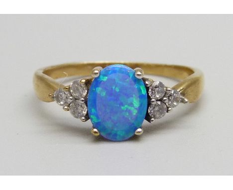 A silver gilt synthetic opal and zircon ring, U 