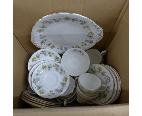 A Paragon tea set including five cups, a sugar bowl, eight saucers, nine side plates and one serving plate, and a Berkshire t