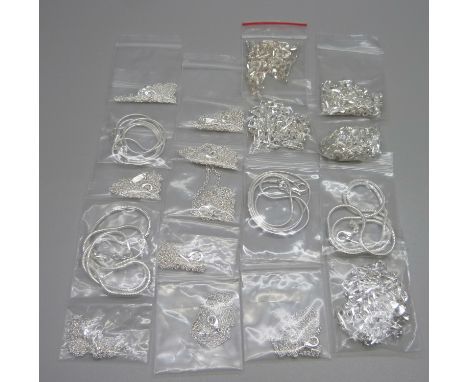 Eighteen unused silver chains 