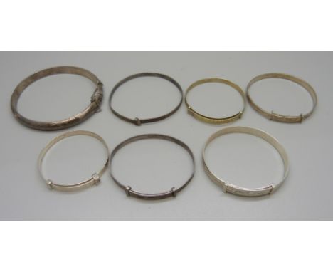 Five silver bangles and two others unmarked, (6 child size) 