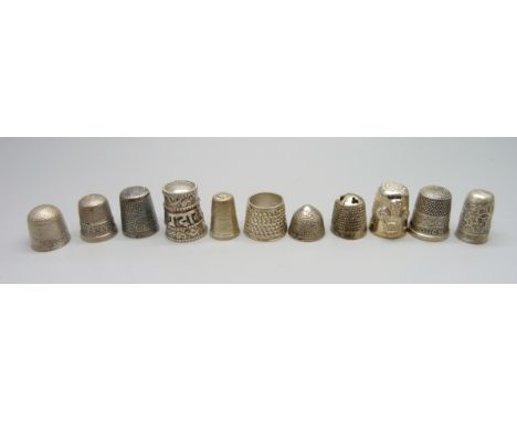 Ten silver thimbles and one other 