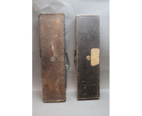 Two shotgun motor cases, the first canvas and leather trimmed opening to a green baize lined interior with space for 30" barr