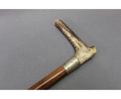 Swaine &amp; Co London, an antler handled riding crop with inset button Swaine &amp; Co London, having a silver coloured coll