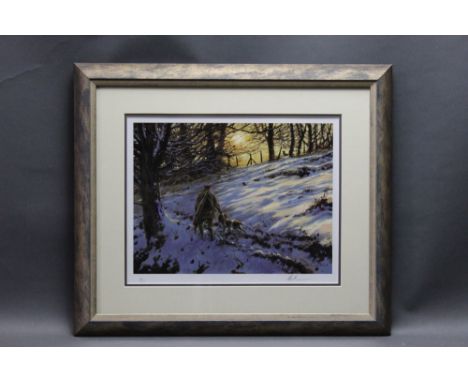 Mick Cawston a signed limited edition print, depicting shooter and spaniel in snow observing a fox, 96/500, 26 x 35 cm, frame