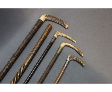 Five riding crops to include two children's or ladies crops, the first with antler handle and silver collar, makers mark RS L