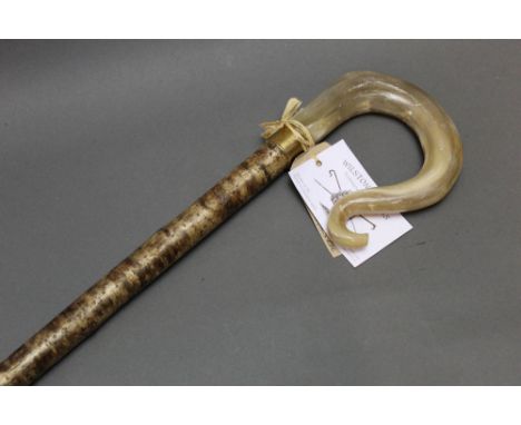 A hazel shafted walking stick with rams horn handle, with attached label for Wilstone Sticks, hand crafted by John Evans - me