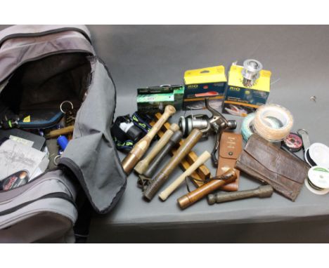 A bag filled with fly lines, priests, Shakespeare fixed spool reel, headlamp etc.