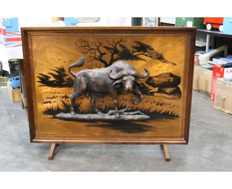 A large African firescreen, depicting a Cape Buffalo.  Height 87 cm, width 111 cm.