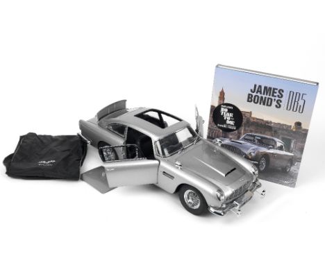 A 1:8 scale model of the James Bond 'Goldfinger' Aston Martin DB5 by Eaglemoss,finely detailed kit-built model from the Eagle