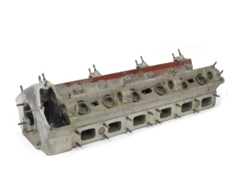 A C-Type Jaguar cylinder head, 1951-53,used, casting pattern number C7707 C3 RH567, also stamped G6023-8S, BE760MT with corre