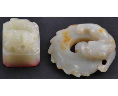 A light jade seal and pendant both carved into mythical beasts