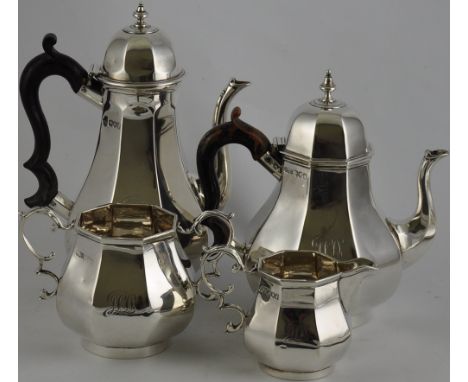An Edwardian Queen Anne style silver 4 piece tea and coffee service of panelled form with domed lids and scroll handles, Lond