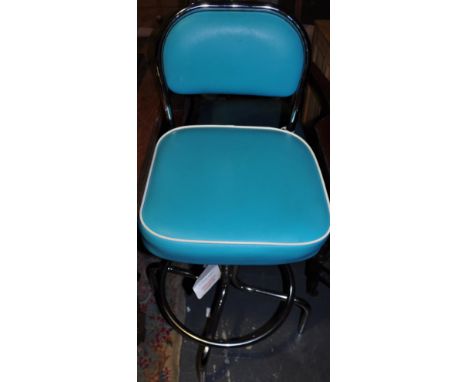 An American diner style chrome bar stool upholstered in turquoise leatherette